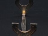 a close up of a metal object on a black surface
