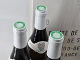 three bottles of wine sitting next to each other on a table