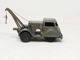 a toy tow truck with a crane attached to it ' s back