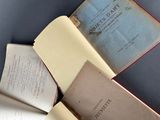 three open books sitting on top of a table next to each other