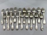 a lot of silver spoons and forks on the table