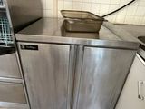 a kitchen with a sink, stove, and dishwasher in it