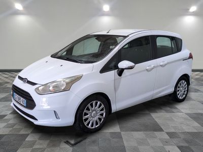the white ford b - max is parked on a checkered floor