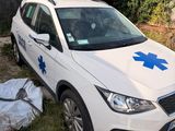 the car is parked in the yard with a blue star on it
