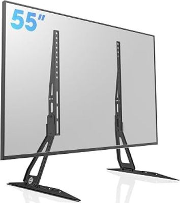 a flat screen tv sitting on top of a stand next to a mirror