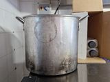a large pot sitting on top of a stove in a kitchen
