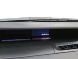 the dashboard of a car with a digital clock on the dash