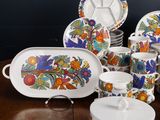an image of a table topped with plates and bowls on top of a wooden table