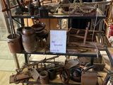 a display of antique items on a shelf in a room
