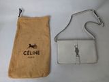 an image of a purse and a cell phone case sitting on a table