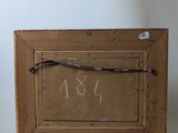 an old wooden picture frame with a chalkboard attached to it