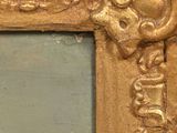 a picture of a gold frame with a skull on it