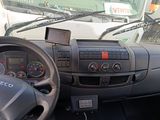 a dashboard of a truck with a steering wheel and a dash board
