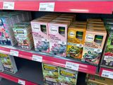 many boxes of tea on the shelf in the store