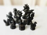 three figurines that are sitting on a table