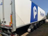 a semi truck that is parked on the side of the road