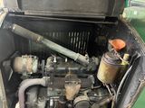 an old car engine in the back of it ' s trunk