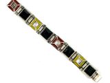 a close up of a bracelet on a white surface