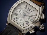 a close up of a watch with roman numerals on it