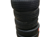 several tires stacked on top of each other on a white surface