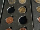 a lot of coins that are in a box