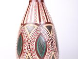 a vase with a design on it on a white background