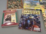 a lot of comic books on the table