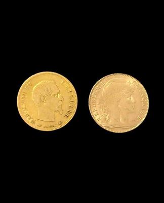 a close up of two gold coins on a black background