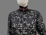 a woman ' s black and white jacket with a red stripe around the collar