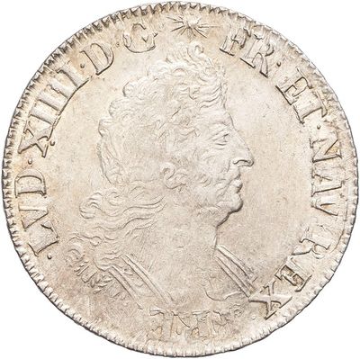 a silver coin with a woman ' s head on it