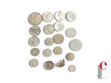 a lot of coins that are on a white surface