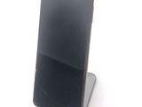 a cell phone that is sitting on top of a stand