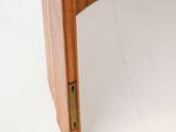 a close up of a wooden desk with a drawer underneath it
