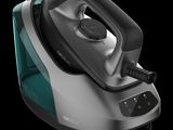 a close up of a steam iron on a black background