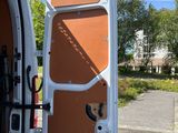 a white van with the door open and a bike in the back