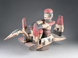 une image représentant une sculpture d'un homme sur un bateau