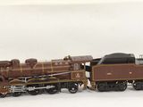 a toy train that is sitting on a white surface