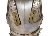 a close up of a metal armor on a white background