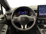 the interior of a car with a steering wheel, dashboard, and touch screen