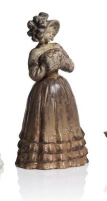 three figurines of a woman in a dress and a man in a hat