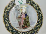 a close up of a plate with a picture of a man and a woman on it