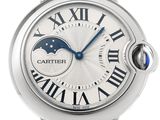 a close up of a wrist watch with a blue second hand