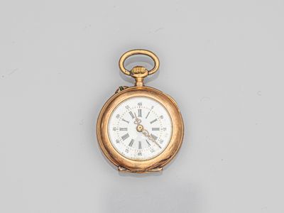 a gold pocket watch with roman numerals and roman numerals