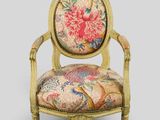an image of a chair with a floral upholstered back