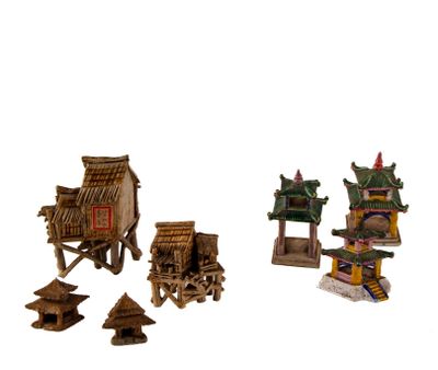 une petite collection de bâtiments asiatiques miniatures sur fond blanc