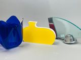 a blue vase and a yellow vase sitting next to each other