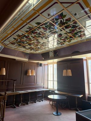 a room that has a stained glass ceiling in it