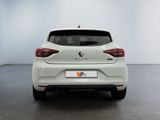 the rear end of a white car in a white room