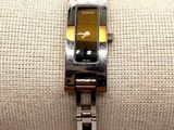 a close up of a wrist watch on a napkin