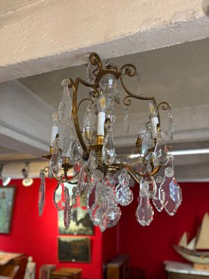 Lustre en bronze doré et pendeloques de cristal à neuf lumiè…